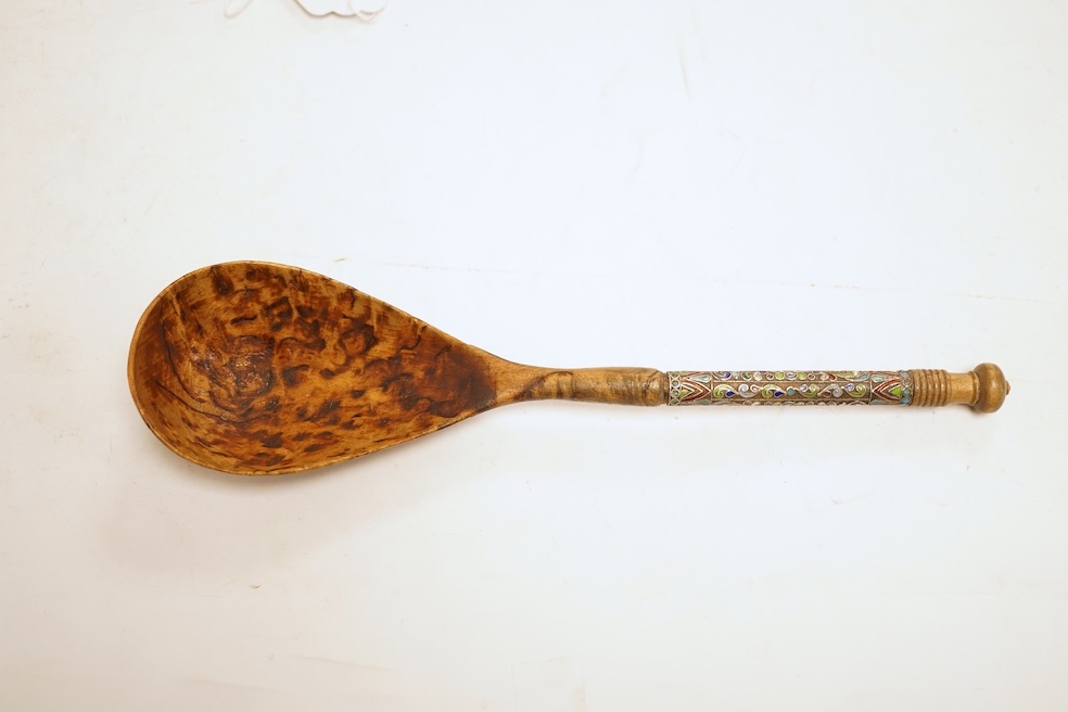 A Russian or eastern European rootwood spoon with enamel handle, 24cm in length